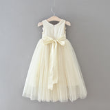 Long cream tulle skirt girl lace dress with overlay and bow belt. Summer sleeveless cream white flower girl lace dress back