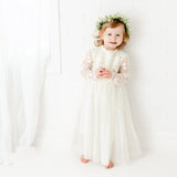 Girl Wearing The Tyra Special Occasion Dress - Ivory