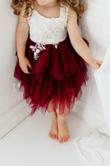 Little Girl Wearing Burgundy Flower Girl Dress